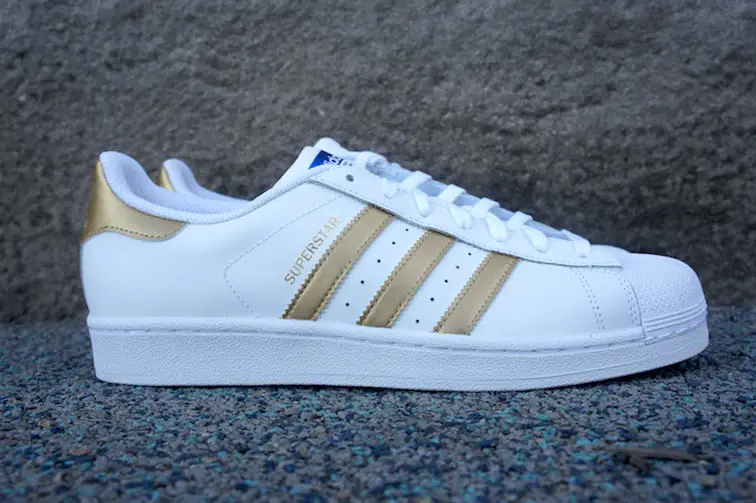 white and gold adidas superstars